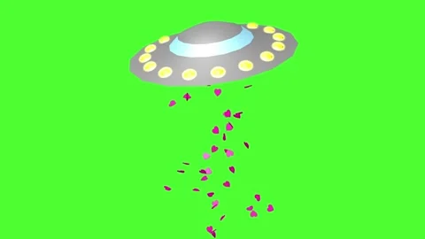 UFO shakes while pink heart confetti spills out on a chromakey background 库存影片 333574740