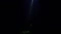 The UFO shines bright light on the man on a dark background 4k or 4k+ Resolution