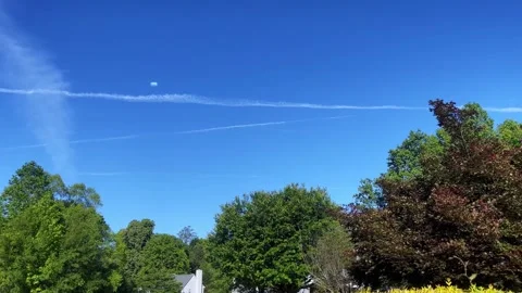 UFO UAP alien space ship Tic Tac shape Residential Daytime Stock Footage 240481371