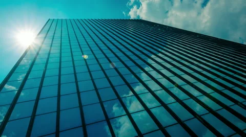 Uge Glass skyscraper sunrays and clouds reflection timelapse 30p Stock Footage 50548987