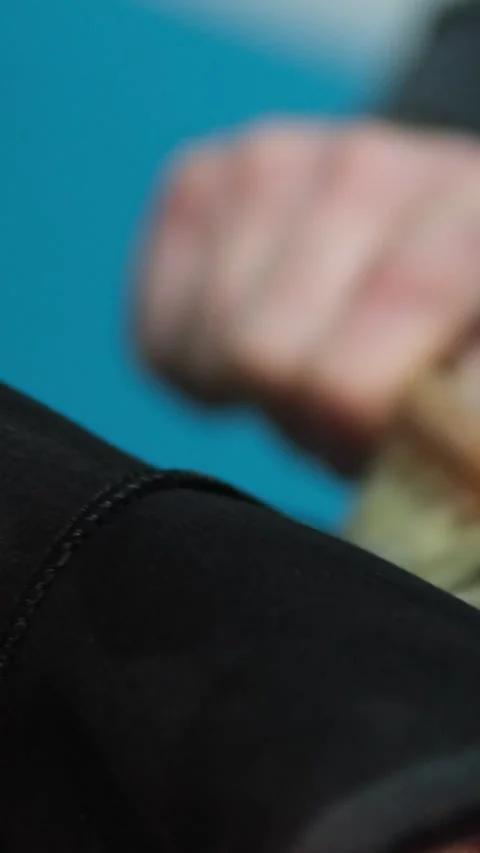 Ugg boots cleaning black boots with brushes in the studio. Male brushing nubuck Stock Footage 296224748