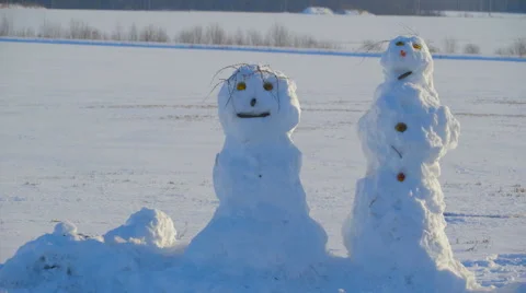 The ugly faced snowman on the side road Stock Footage 61186399