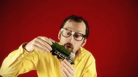 Ugly man model train fun Stock Footage 76000978