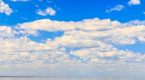 UHD 4K Timelapse rolling clouds over sea horizon line Stock Footage 50610546