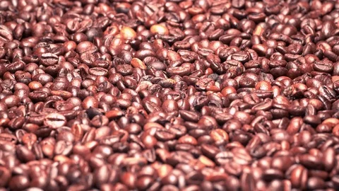 UHD 60 fps closeup shot of the dark roasted coffee beans on a turntable Stock-Footage 104173154