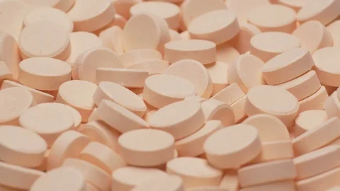 UHD 60 fps macro of the vitamin tablets on a turntable 動画素材 108075965