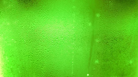 UHD macro of the green bottle of beer as a background Video stock 106079862