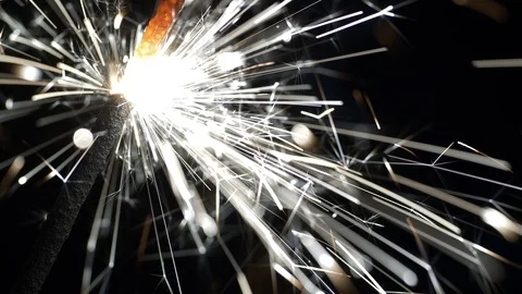 UHD macro of the sparkler burning in the dark Video stock 93450346
