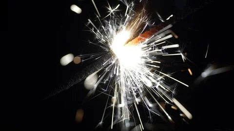 UHD macro of the sparkler burning in the dark Stockbeeldmateriaal 93450453