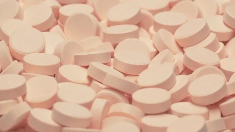 UHD macro of the vitamin tablets on a turntable Stockbeeldmateriaal 108423578