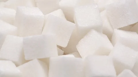 UHD macro of the white sugar cubes on a rotating stand Stockbeeldmateriaal 92192765