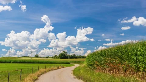 UHD. Time lapse of landscape panorama with a road in the fields Stock Footage