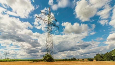 UHD. Time lapse of power lines pylons in the fields Stock Footage 204874357
