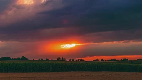 UHD. Timelapse of dramatic sunset with dark clouds Stock Footage 204873876
