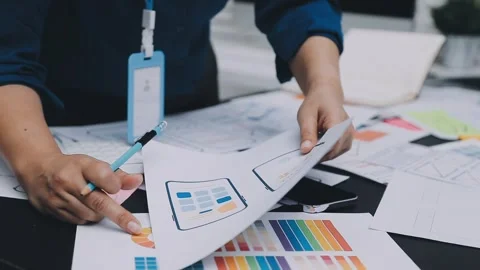 UI designer and UX developer brainstorm idea to design the application appe.. Stock Footage 326018274
