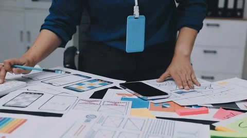 UI designer and UX developer brainstorm idea to design the application appe.. Stock Footage 326018277