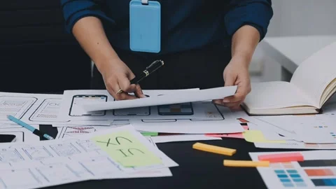 UI designer and UX developer brainstorm idea to design the application appe.. Stock Footage 326018278