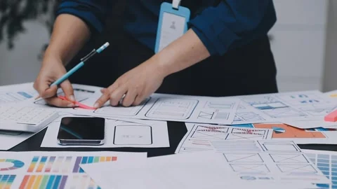 UI designer and UX developer brainstorm idea to design the application appe.. Stock Footage 326018281