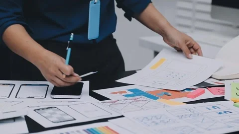 UI designer and UX developer brainstorm idea to design the application appe.. Stock Footage 326018282