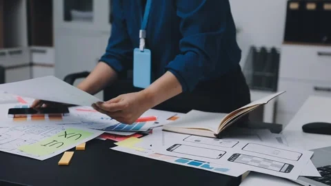UI designer and UX developer brainstorm idea to design the application appe.. Stock Footage 326018294
