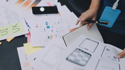 UI designer and UX developer brainstorm idea to design the application appe.. Video stock 326018295