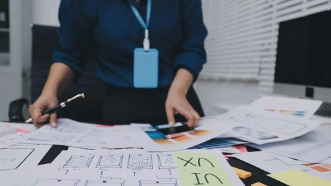 UI designer and UX developer brainstorm idea to design the application appe.. Stock Footage 326018296