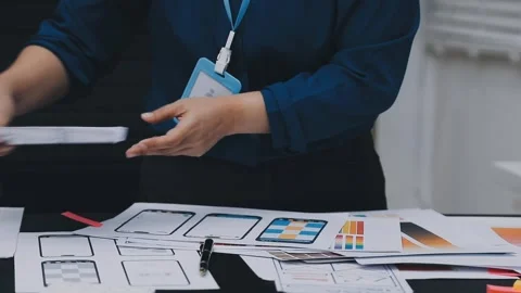 UI designer and UX developer brainstorm idea to design the application appe.. Stock Footage 326018302