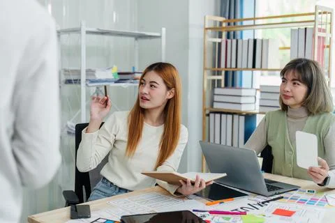 UI designer and UX developer brainstorm idea to design the application Stock Photos