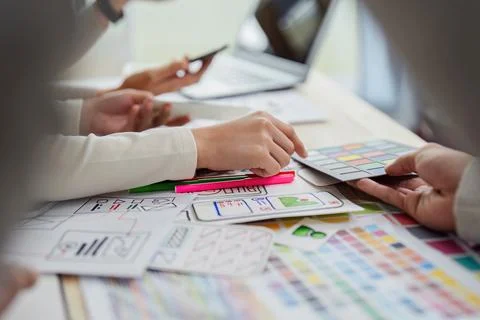 UI designer and UX developer brainstorm idea to design the application Stock Photos