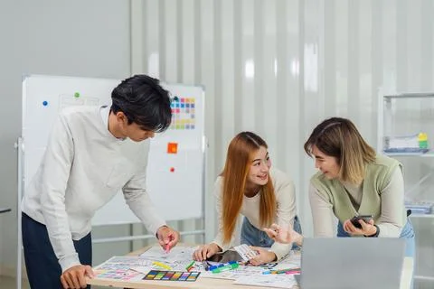 UI designer and UX developer brainstorm idea to design the application interface Stock Photos