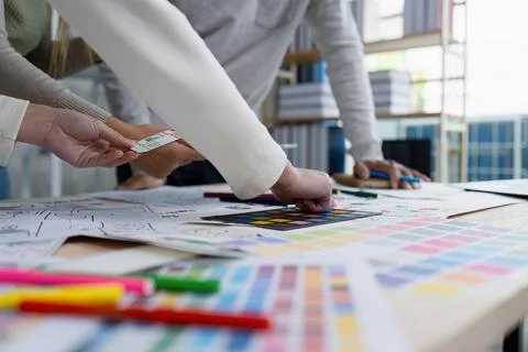 UI designer and UX developer brainstorm idea to design the application Stock Photos