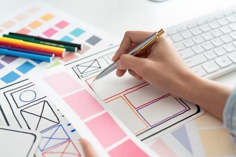 UI designer and UX developer brainstorm idea to design the application interface Stock Photos