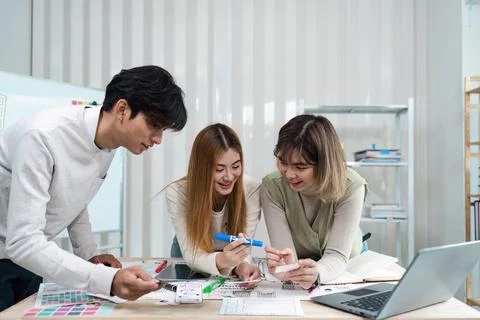 UI designer and UX developer brainstorm idea to design the application Stock Photos