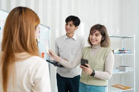 UI designer and UX developer brainstorm idea to design the application Stock Photos