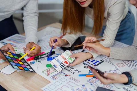 UI designer and UX developer brainstorm idea to design the application Stock Photos