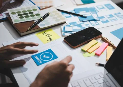 UI designer and UX developer brainstorm idea to design the application appe.. Stock Photos