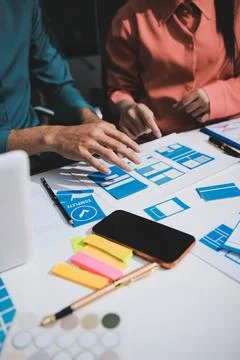 UI designer and UX developer brainstorm idea to design the application appe.. Stock Photos