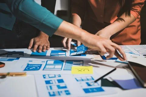 UI designer and UX developer brainstorm idea to design the application appe.. Stock Photos