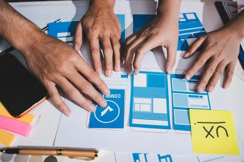 UI designer and UX developer brainstorm idea to design the application appe.. Stock Photos