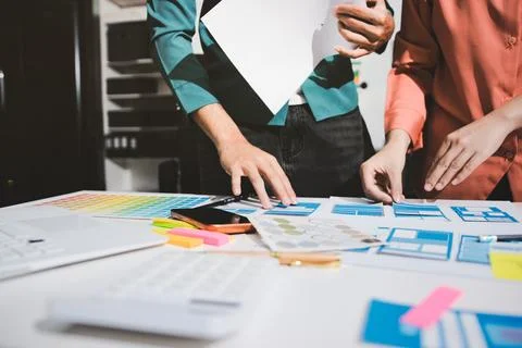 UI designer and UX developer brainstorm idea to design the application appe.. Stock Photos