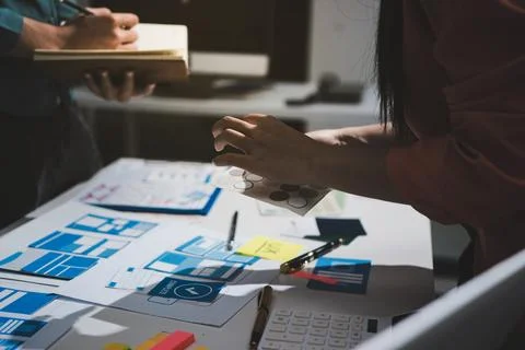 UI designer and UX developer brainstorm idea to design the application appe.. Stock Photos