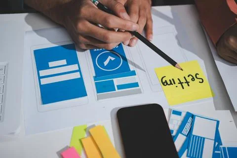 UI designer and UX developer brainstorm idea to design the application appe.. Stock Photos