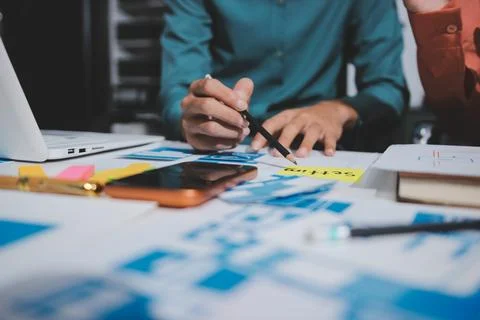 UI designer and UX developer brainstorm idea to design the application appe.. Stock Photos