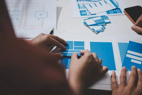 UI designer and UX developer brainstorm idea to design the application appe.. Stock Photos