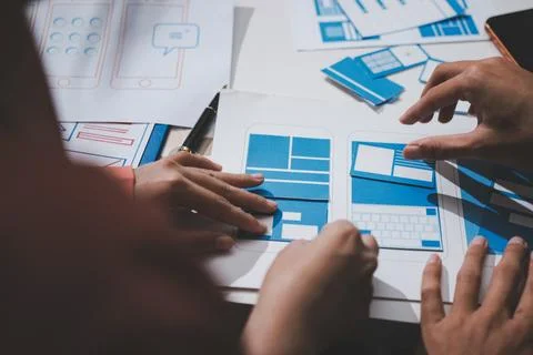 UI designer and UX developer brainstorm idea to design the application appe.. Stock Photos