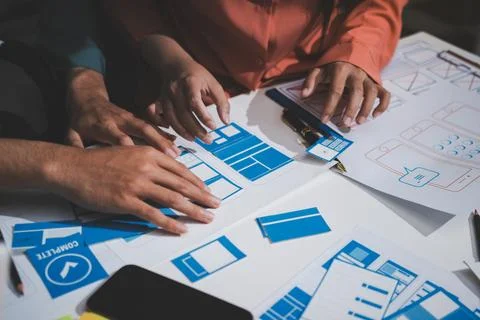 UI designer and UX developer brainstorm idea to design the application appe.. Stock Photos