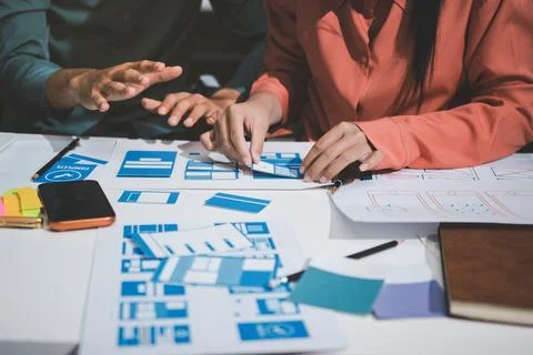 UI designer and UX developer brainstorm idea to design the application appe.. Stock Photos