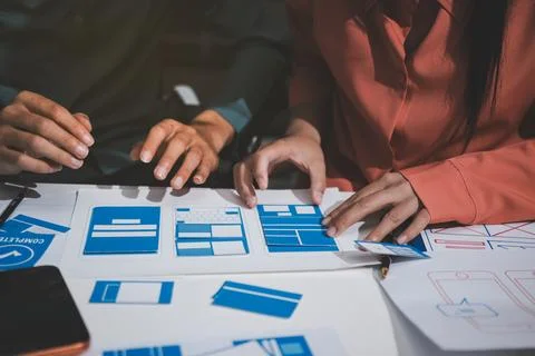 UI designer and UX developer brainstorm idea to design the application appe.. Stock Photos