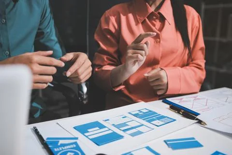 UI designer and UX developer brainstorm idea to design the application appe.. Stock Photos