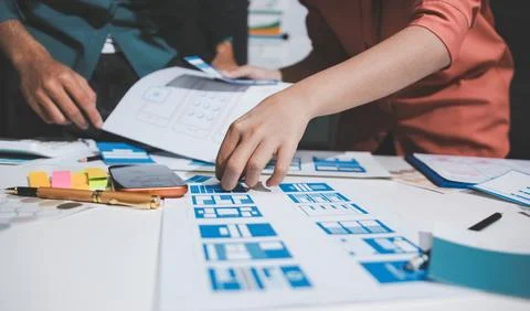 UI designer and UX developer brainstorm idea to design the application appe.. Stock Photos